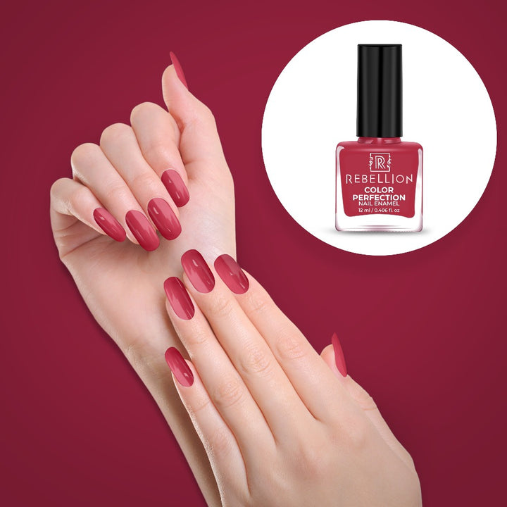 Rebellion old rose pink nail enamel application on nails