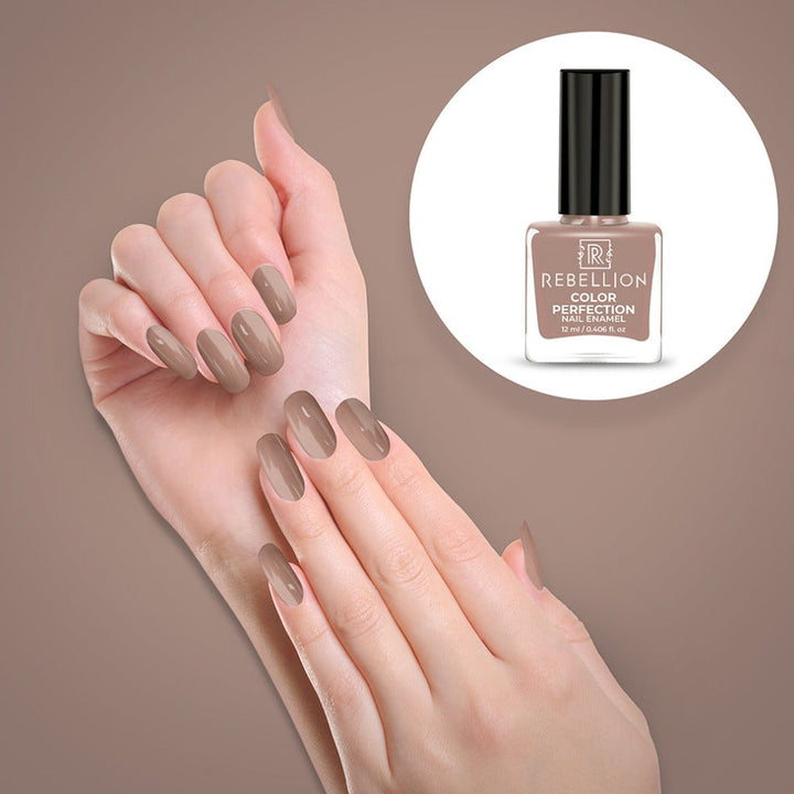 Rebellion nude brown nail enamel application on nails