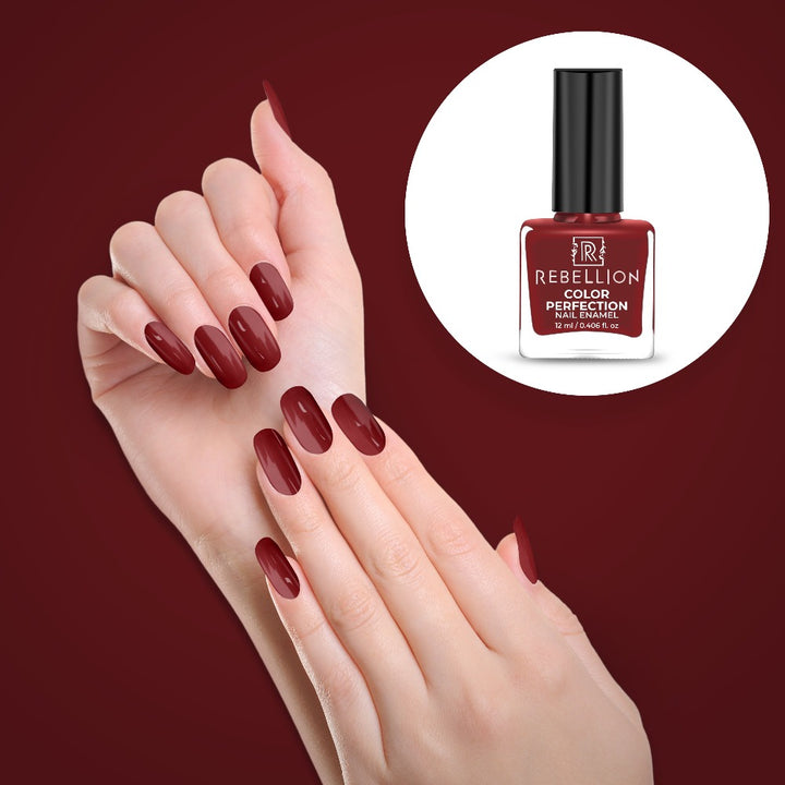 Rebellion maroon red nail enamel application on nails