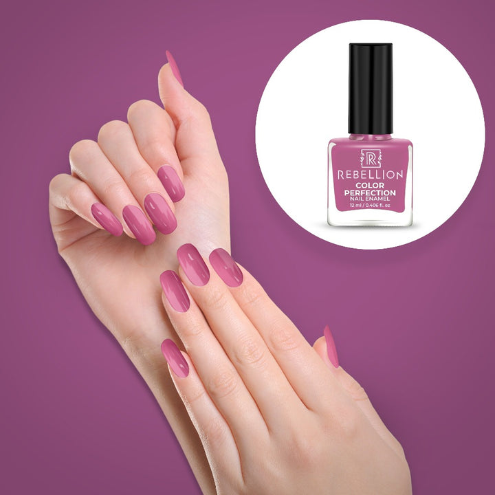 Rebellion violet pink nail enamel application on nails
