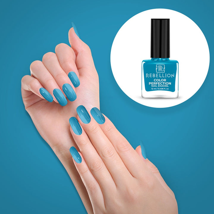 Rebellion cyan blue nail enamel application on nails