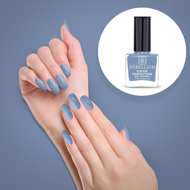 Rebellion sky blue nail enamel application on nails
