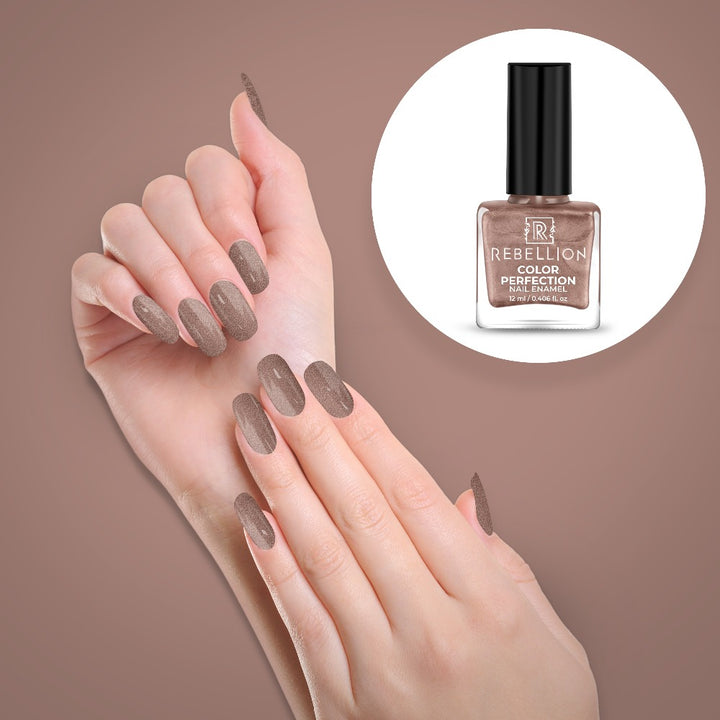 Rebellion desert brown nail enamel application on nails