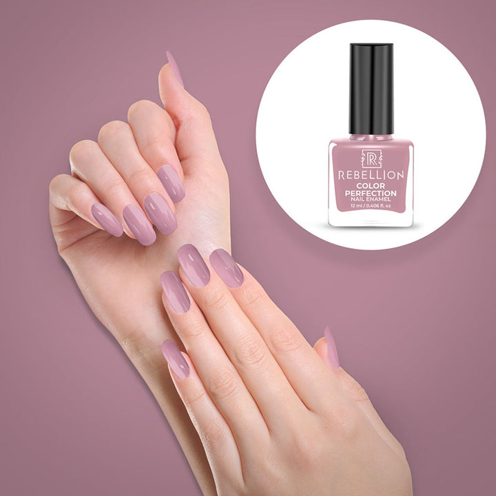 Rebellion mauve pink nail enamel application on nails