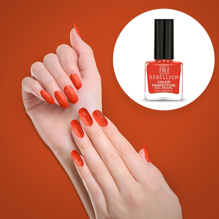 Rebellion orange nail enamel application on nails