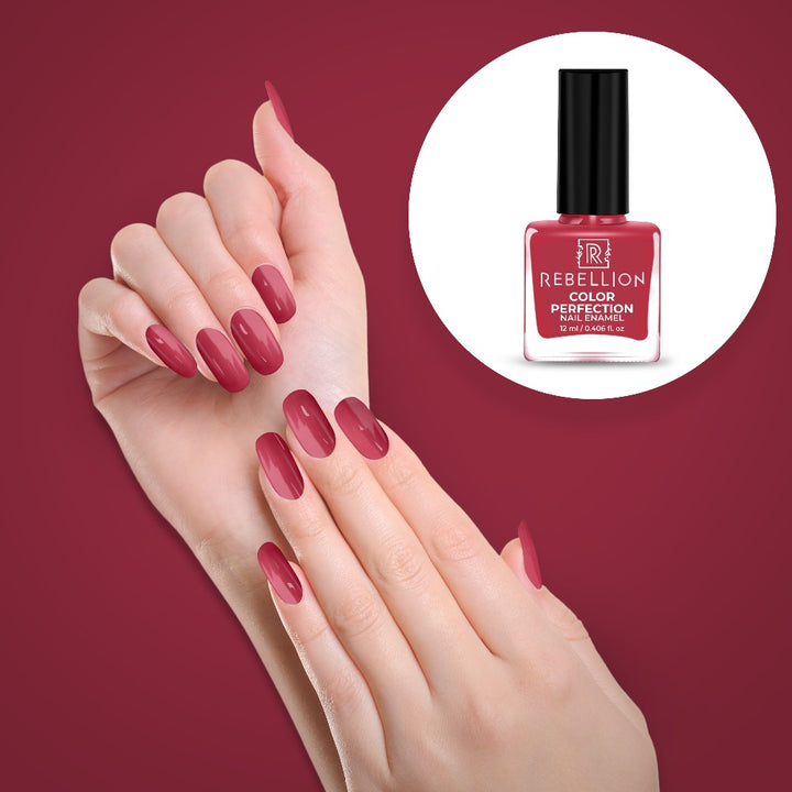 Rebellion rose pink nail enamel application on nails