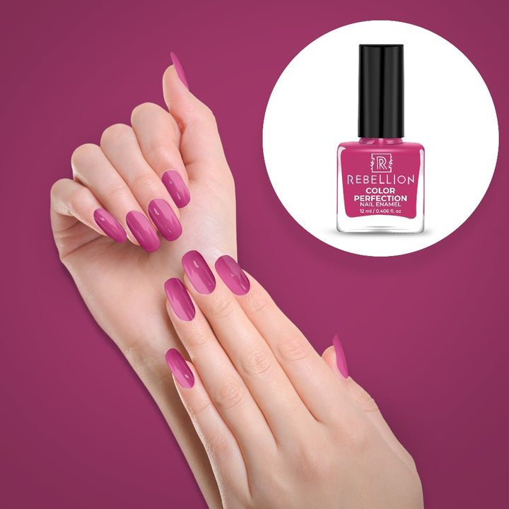 Rebellion rouge pink nail enamel application on nails