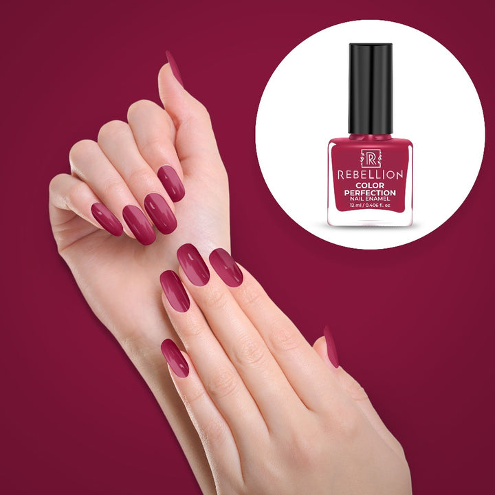 Rebellion berry pink nail enamel application on nails