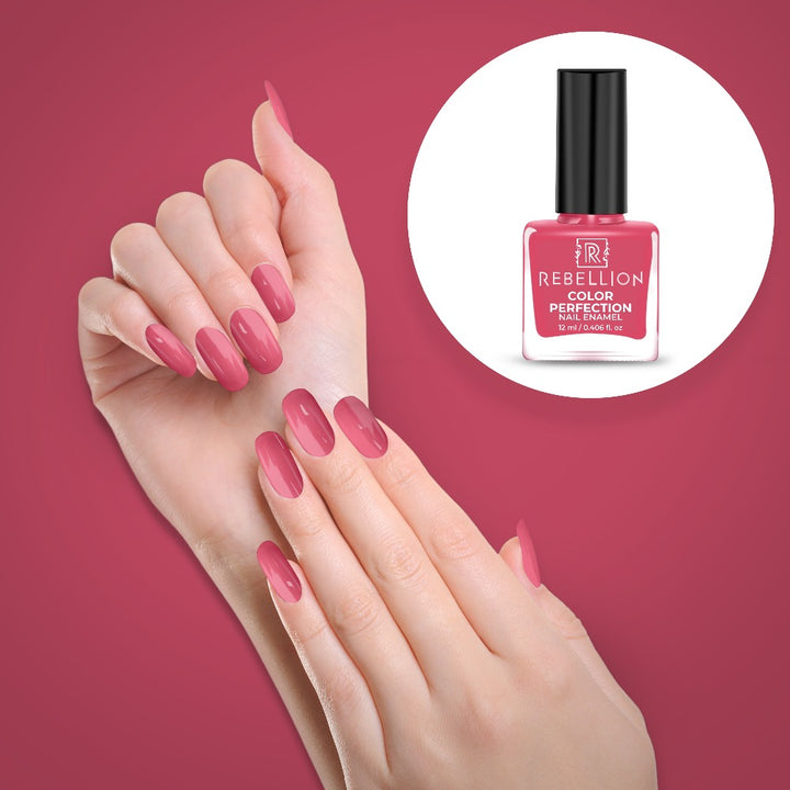 Rebellion coral pink nail enamel application on nails