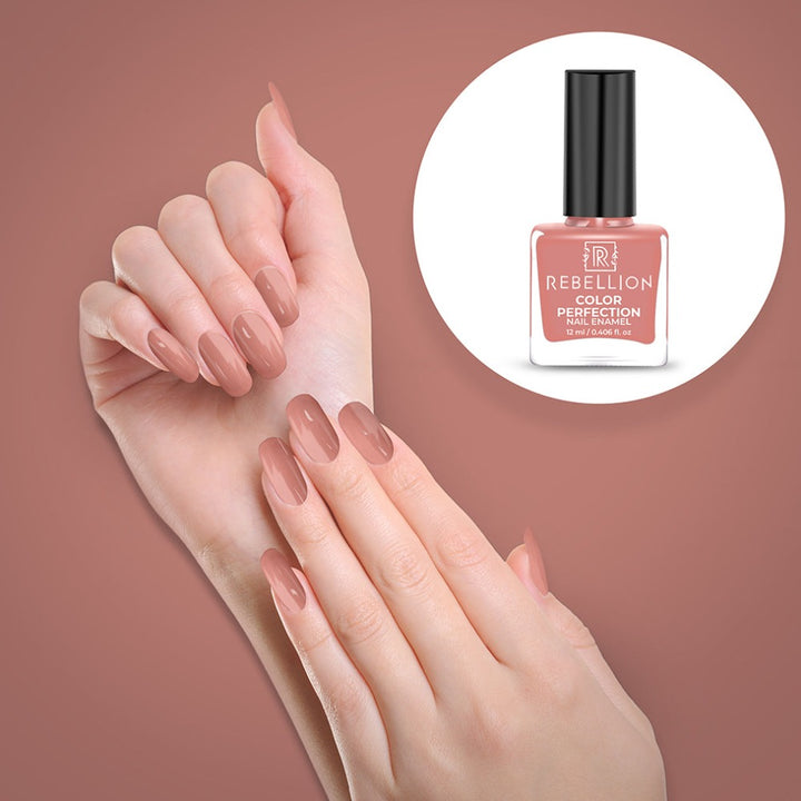 Rebellion salmon pink nail enamel application on nails