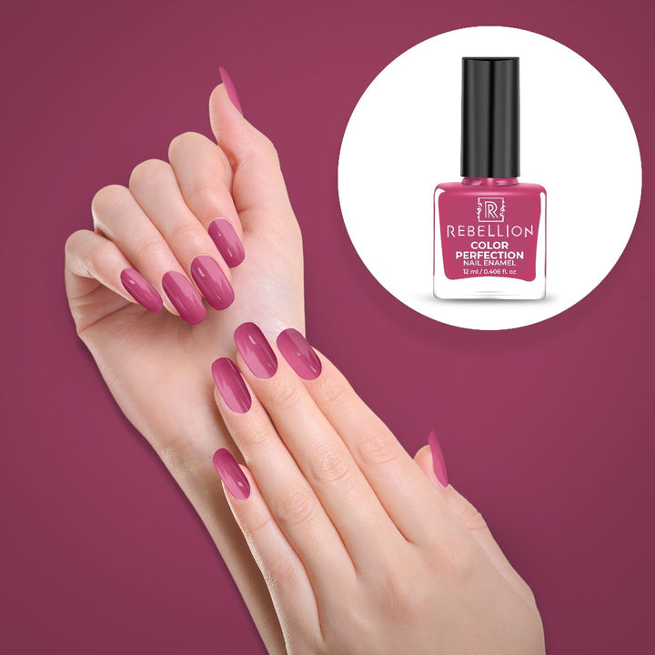 Rebellion dark violet pink nail enamel application on nails